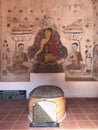 Mural painting and four Buddha footprints stacked together in the sanctuary of Buppharam temple Wat Buppharam or Wat Plai Khlong