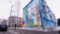 Mural of pilot Valeriy Chkalov on blue dwelling in winter