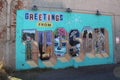 Mural of a postcard painted on a wall in Tucson