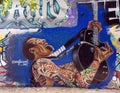 Mural by Sharleen in the Fabrication Yard in Dallas, Texas, featuring guitar player.