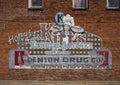 Mural sign on an outside brick wall of Kitt`s Kornbread Sandwich and Pie Bar in Jefferson, Texas.