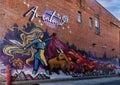 A mural titled `Aventura` featuring a female bullfighter by talented tattoo artist Martin Kazan in Ann Arbor, Michigan.