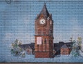 Mural with University of Central Oklahoma clock tower on the side of the student bookstore.