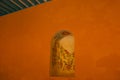 Mural on the wall: drawing flowers and sun. Yellow church and colonial architecture in San Francisco de Campeche., Mexico Royalty Free Stock Photo