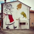 A murales of a little girl and a frog