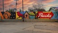 Murals on a wooden fence at Buck Atom`s Cosmic Curios on Route 66 in Tulsa, Oklahoma.