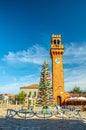 Murano clock tower Torre dell`Orologio of San Stefano church, Colorful christmas tree made of Murano Glass Royalty Free Stock Photo