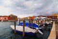 Murano, Italy - October, 6 2019: Typical street on Murano island in Venice, wharf for gondolas and boats, glass blowing Royalty Free Stock Photo