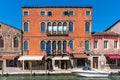 Murano, Italy - September 16, 2019: Amazing view of channel on Murano with tourist shops and restaurants in Italy