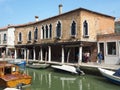 Murano, Venezia, Italy. View at canal with boats and the traditional houses