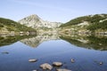 Muratov peak and its reflection in Banderishko Frog lake in the Pirin National Park, Bulgaria Royalty Free Stock Photo