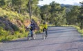 Murcia, Spain - April 9, 2019: Pro road cyclists enduring a difficult mountain ascent on his cool bicycle Royalty Free Stock Photo