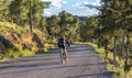 Murcia, Spain - April 9, 2019: Pro road cyclists enduring a difficult mountain ascent on his cool bicycle Royalty Free Stock Photo