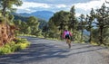 Murcia, Spain - April 9, 2019: Pro road cyclists enduring a difficult mountain ascent on his cool bicycle Royalty Free Stock Photo