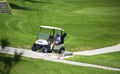 Murcia, Spain, August 25, 2019: Sportman riding a golf cart in the goulf course Royalty Free Stock Photo
