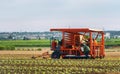 Murcia, Spain, December 12, 2019: Modern machinary for cultivation of lettuces in new plantation. Tractor in agricultural field in