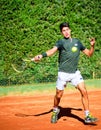 Murcia, Spain, December 26, 2019: Seventeen years old boy play tenis for recreation on clay court in Murcia. Image taken as a Royalty Free Stock Photo