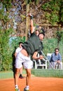 Murcia, Spain, December 26, 2019: Young sportsman training at a tennis clay court in Murcia