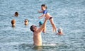 Murcia, Spain, July 20, 2019: Family having fun on summer beach