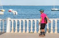 Murcia, Spain, June 2019: An elderly, senior old man, rollerblading in the park