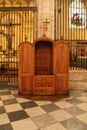 Old wooden confessional in the cathedral of Murcia