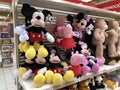 MURCIA, SPAIN - NOVEMBER 2, 2021: Many stuffed dolls are displayed on a shelf in a spanish supermarket in the toy aisle