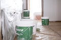 Murcia, Spain, October 28, 2019: Wall painting. Preparing tools for painting walls. Paint brush and paint buckets in room interior