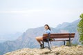 Murcia, Spain, September 22, 2019: Attractive young girl at the top of a mountain smiling at camera