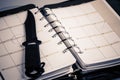 Murder planning concept - calendar and knife Royalty Free Stock Photo