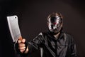 Murderer in hockey mask with meat cleaver in hand