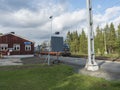 Murjek, Norrbotten, Sweden, Agust 22, 2019: Old red bulding of Train station at Murjek with goods train to Kiruna