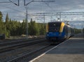 Murjek, Norrbotten, Sweden, Agust 22, 2019: view on railway line with arriving Norrtag passenger train to Kiruna. Train station at