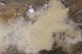 Murky water puddle on dirt ground grunge texture