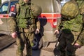 Military police officers stand by the car