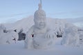 Murmansk, Russia - January 26, 2014. The snow figure is made in the image of a Sami boy sitting with a tambourine, is in