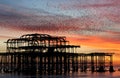 Murmuration over the ruins of Brighton`s West Pier on the south coast of England