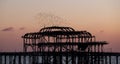 Murmuration of starlings over the ruins of West Pier, Brighton UK. Photographed at dusk, January 2023.