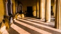 A corridor in an ancient palace with yellow walls and vintage architecture with