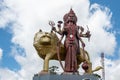 Murti of Durga Maa, Mother Goddess Durga, with golden lion at the entrance to the Ganga Talao Temple at Grand Bassin, Mauritius