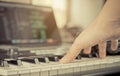 Muscian hand touching Keyboard home studio