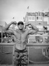 Muscle Beach bodybuilder flexing, black and white