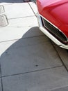 Muscle car nose sidewalk