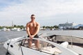 Muscle man on a boat Royalty Free Stock Photo