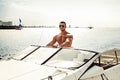 Muscle man on a boat Royalty Free Stock Photo