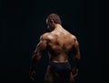 Muscled male model showing his back Royalty Free Stock Photo