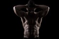 Muscled man on a black background Royalty Free Stock Photo