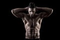 Muscled man on a black background Royalty Free Stock Photo