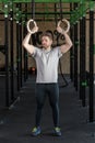 Muscled man practicing cross fit
