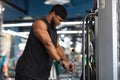 Muscular african american bodybuilder using peck deck machine Royalty Free Stock Photo