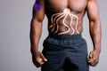 Muscular African American torso. Kinesitherapy tape glued to the abdominal muscles Royalty Free Stock Photo